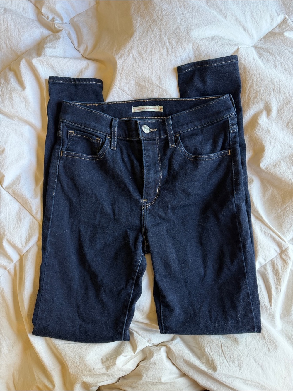 Levi’s dark wash high-rise super skinny jeans. Size 27.
